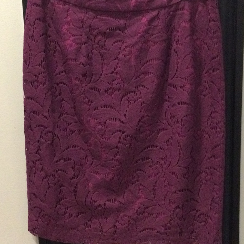 Cabi, lace material with a complimentary color lining.